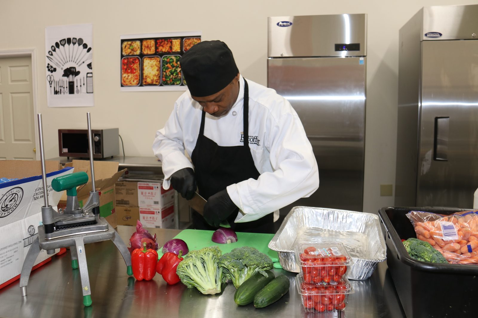 A member prepping fresh vegetables